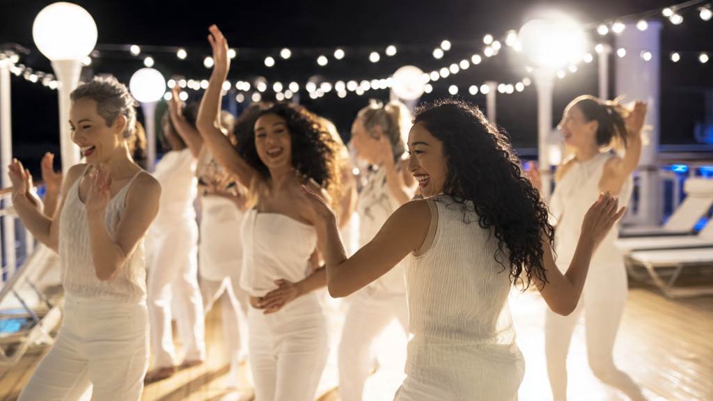 Group of female friends in varied all-white outfits