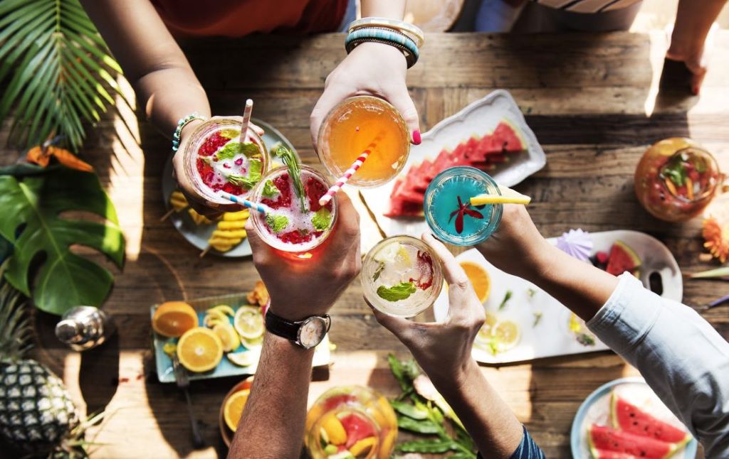 Party table setup with beautifully served food and drinks for guests